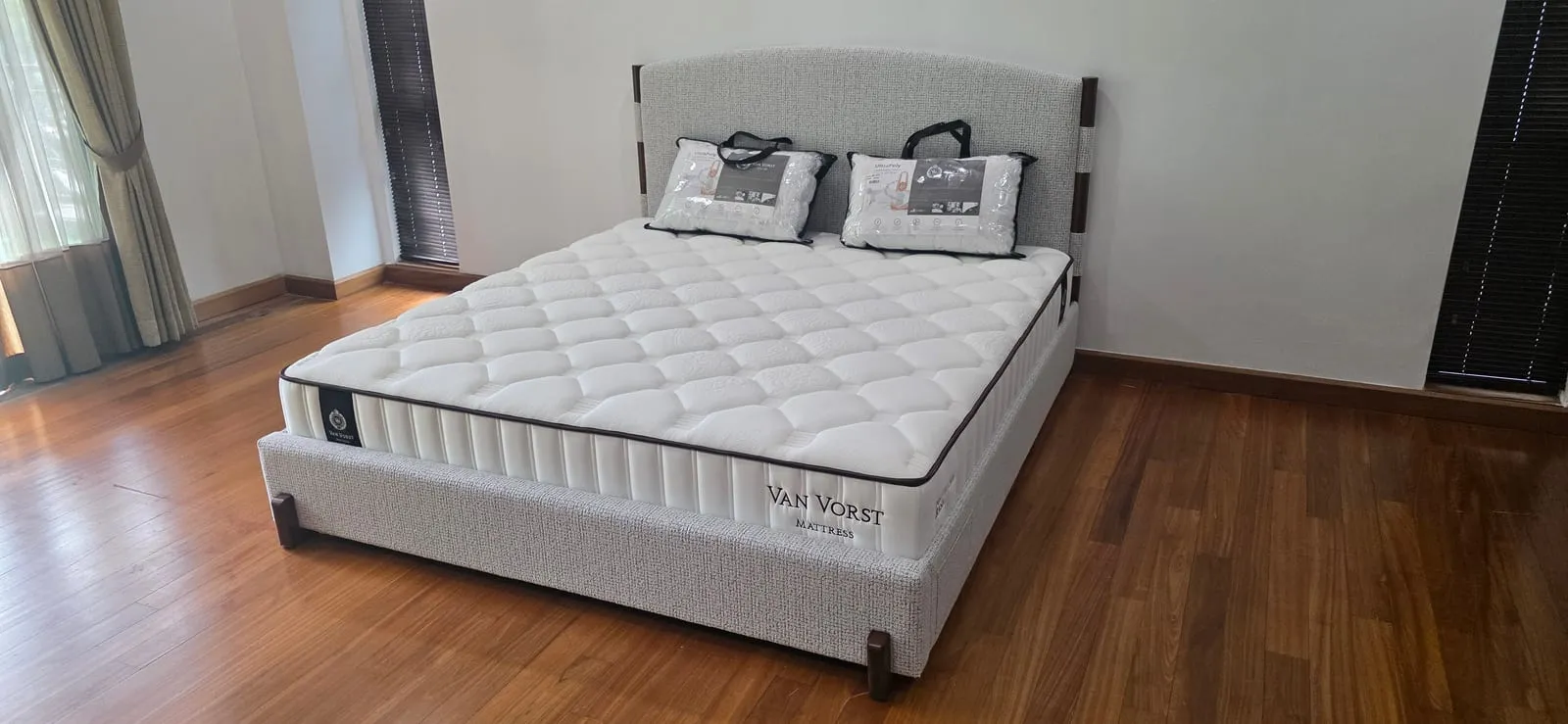 The furnished junior suite at Villa Mont Kiara — a king bed dressed for a long stay, with its own private terrace.